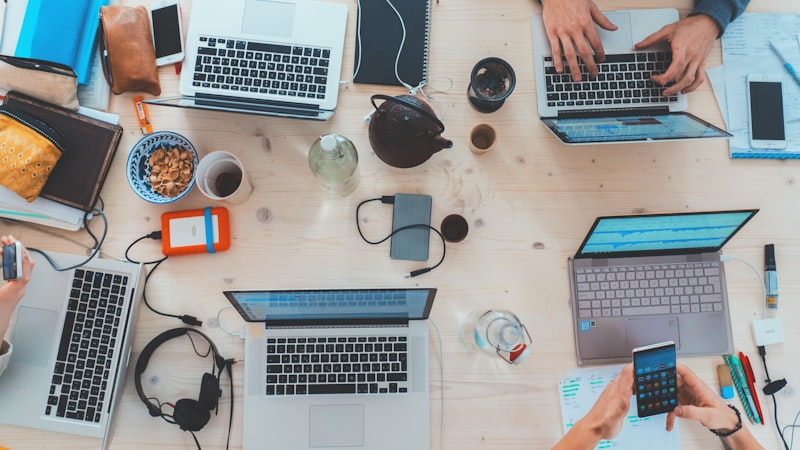 Professionals comparing AI tools at a desk